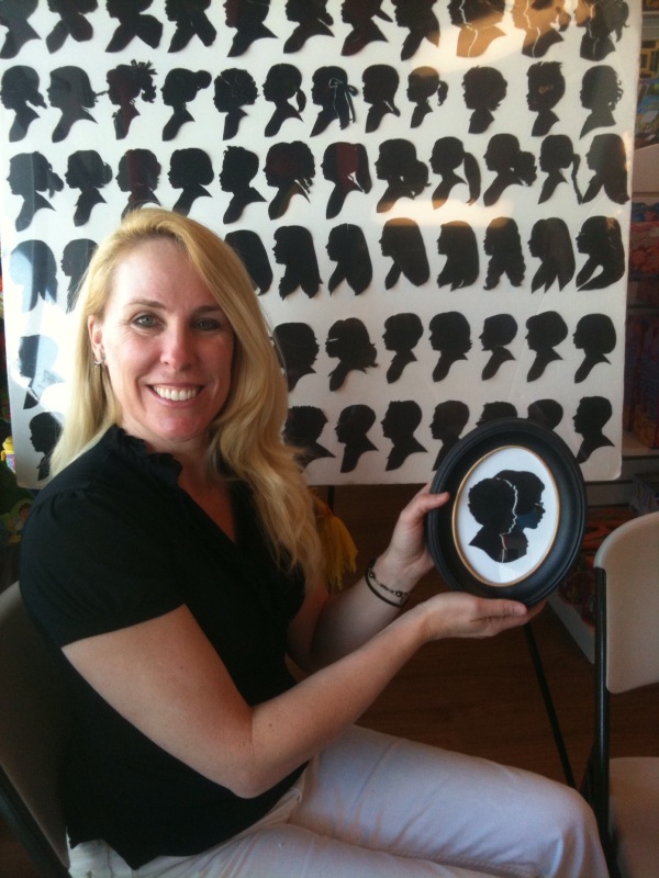 Kathryn Flocken with her display of silhouettes