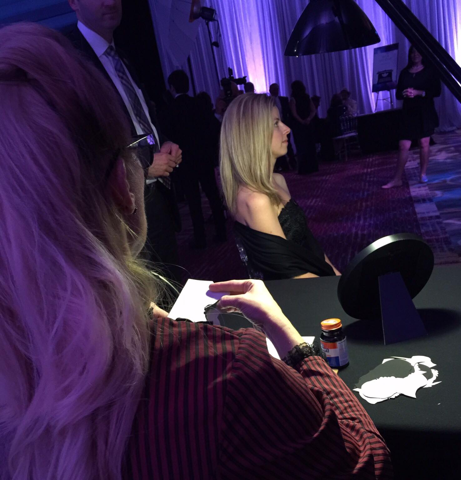 Kathryn Flocken cutting a silhouette at an event